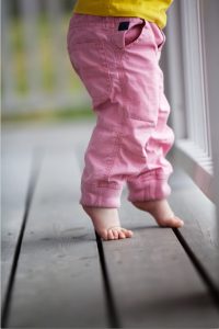 Young child standing on toes