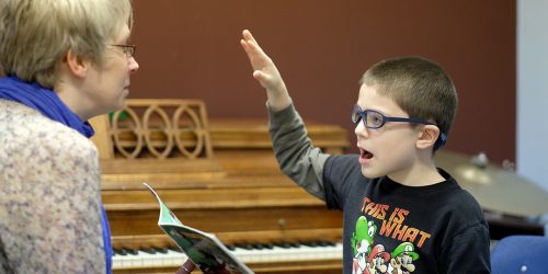 Music therapist works with child
