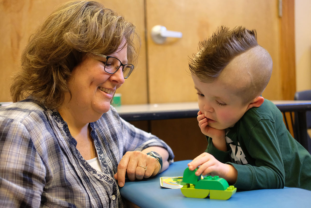 Therapist working with child